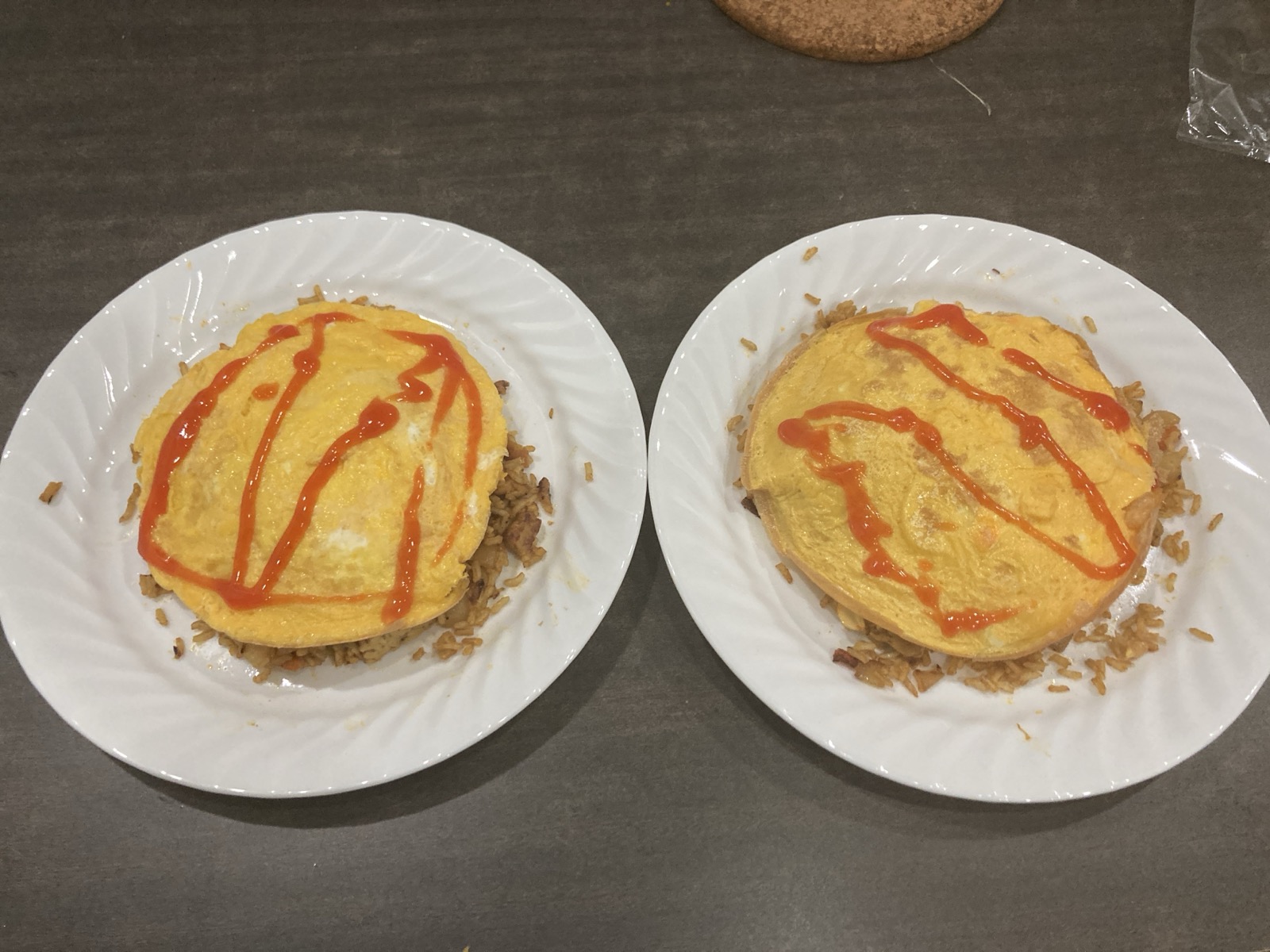 Two plates of Nasi Goreng Pattaya